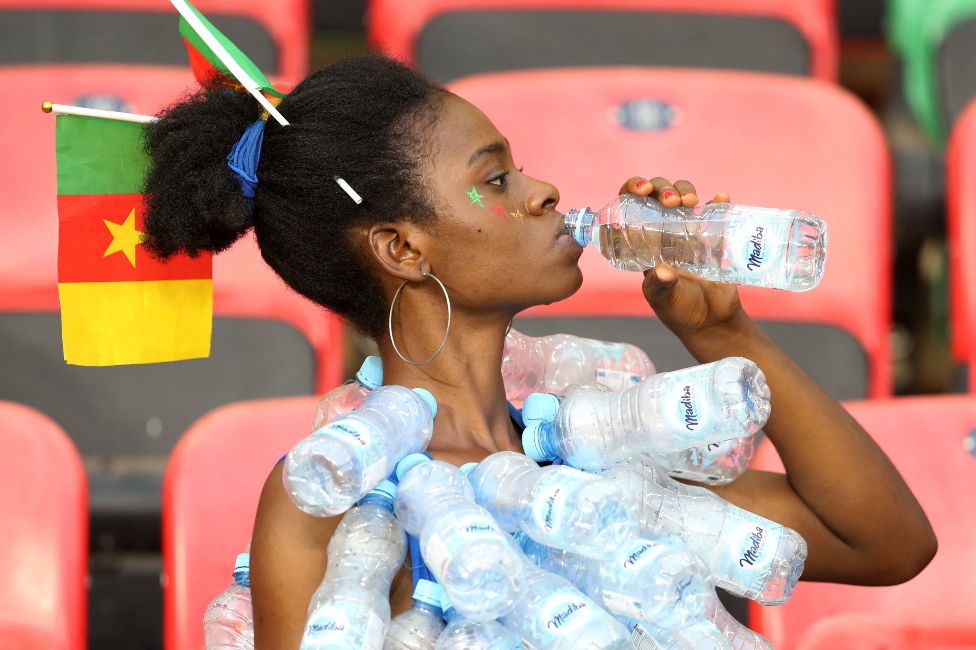 A Cameroon fooball fan takes a sip of water inside a stadium in Yaoundé, Cameroon - Monday 24 January 2020