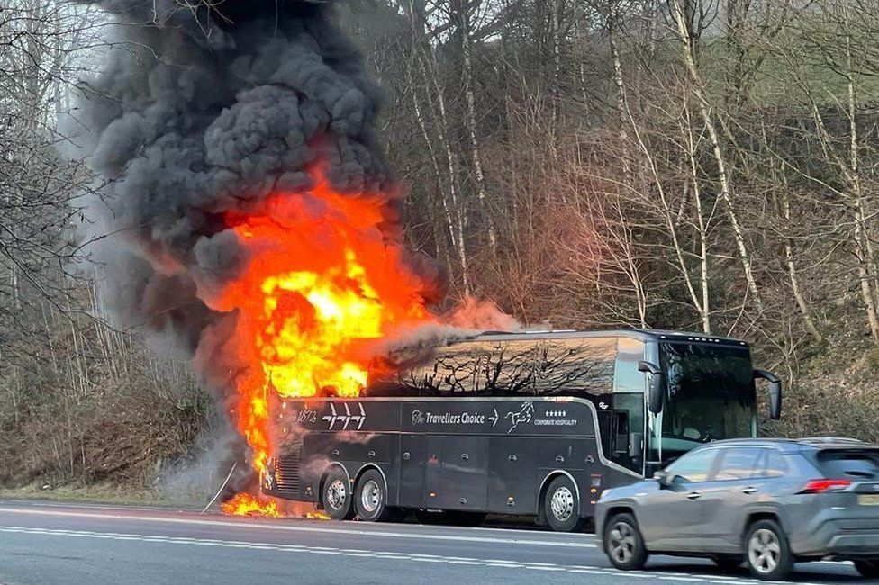 The rear of the coach on fire