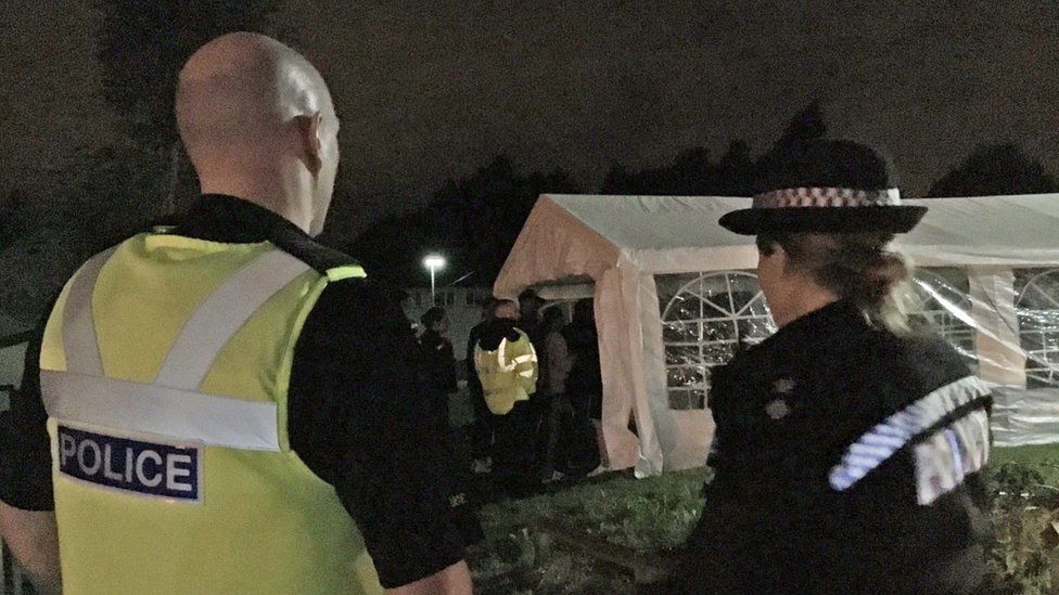Police officers outside a marquee in Birmingham
