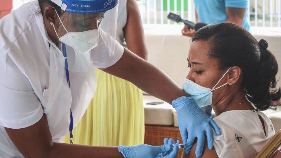Woman receiving jab in Seychelles