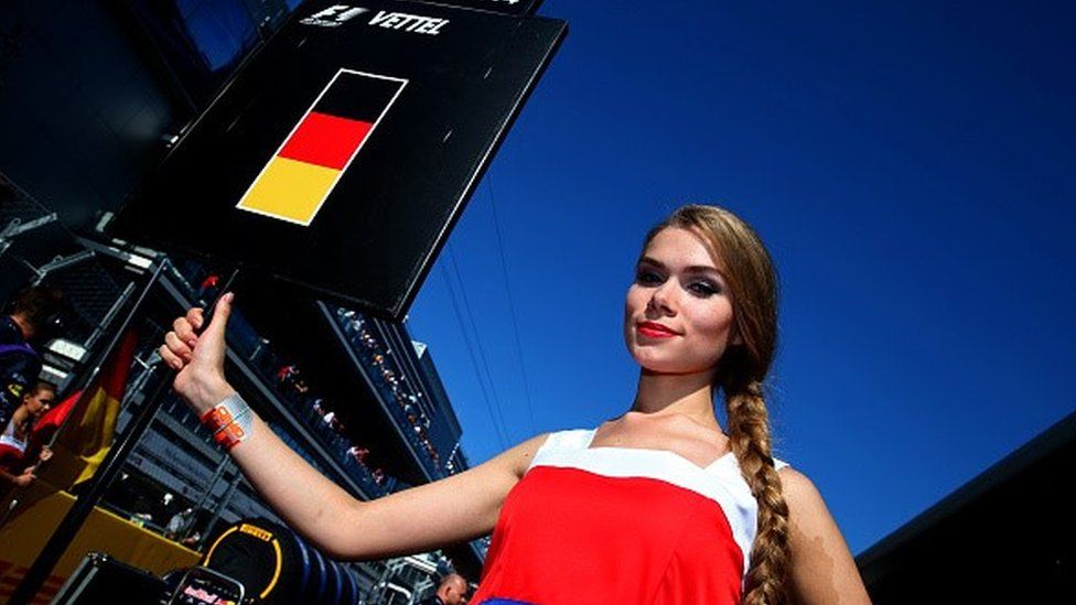 A pit assistant poses before the Russian Formula 1 Grand Prix at Sochi Autodrom in 2014