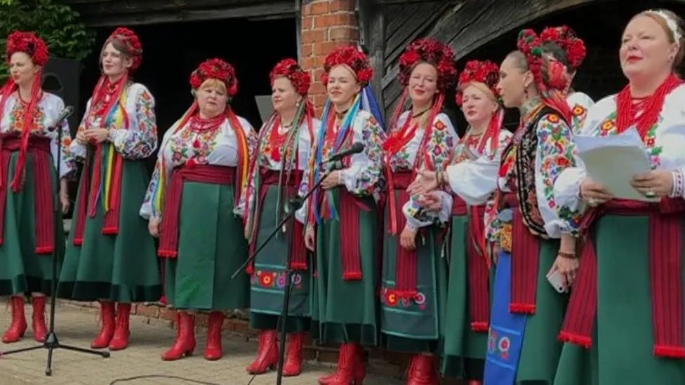 Ukrainian woman in traditional clothing singing