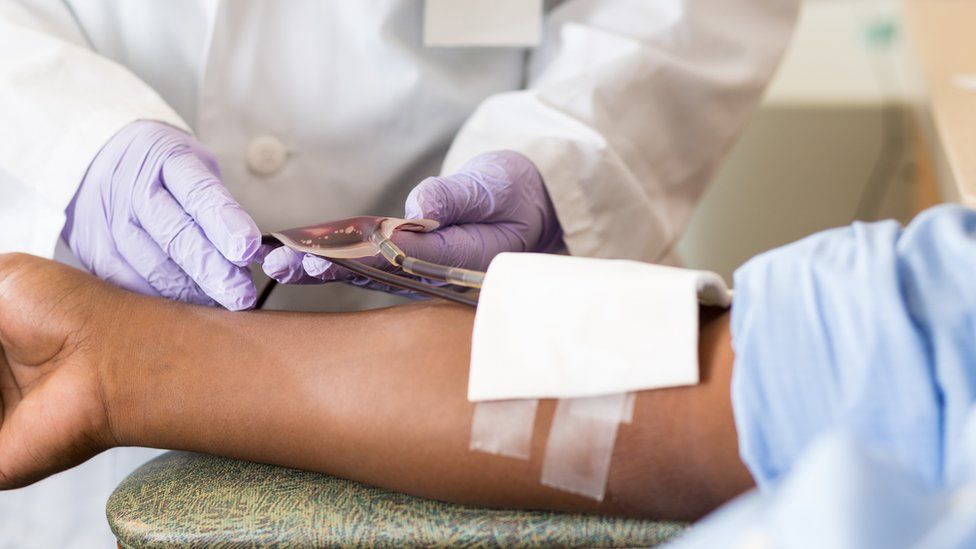 Black man donating blood