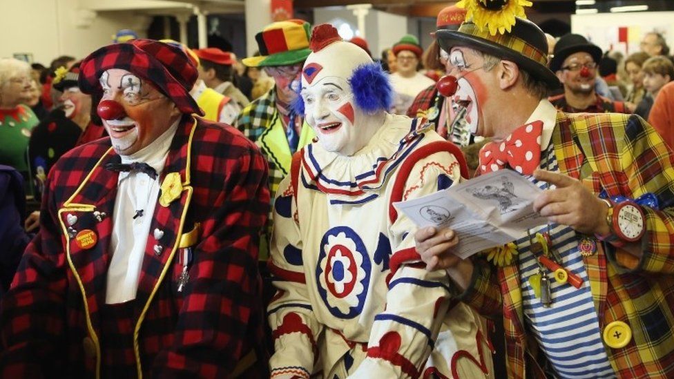 London clown congregation marks 70th circus celebration - BBC News