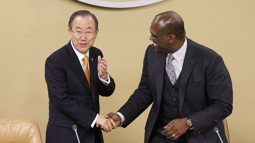Ban Ki-moon greets UN General Assembly President John Ashe (R) of Antigua and Barbuda in 2013