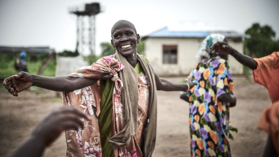Women dancing and celebrating the removal of mines by the UN in Canal Village, Jonglei state, South Sudan