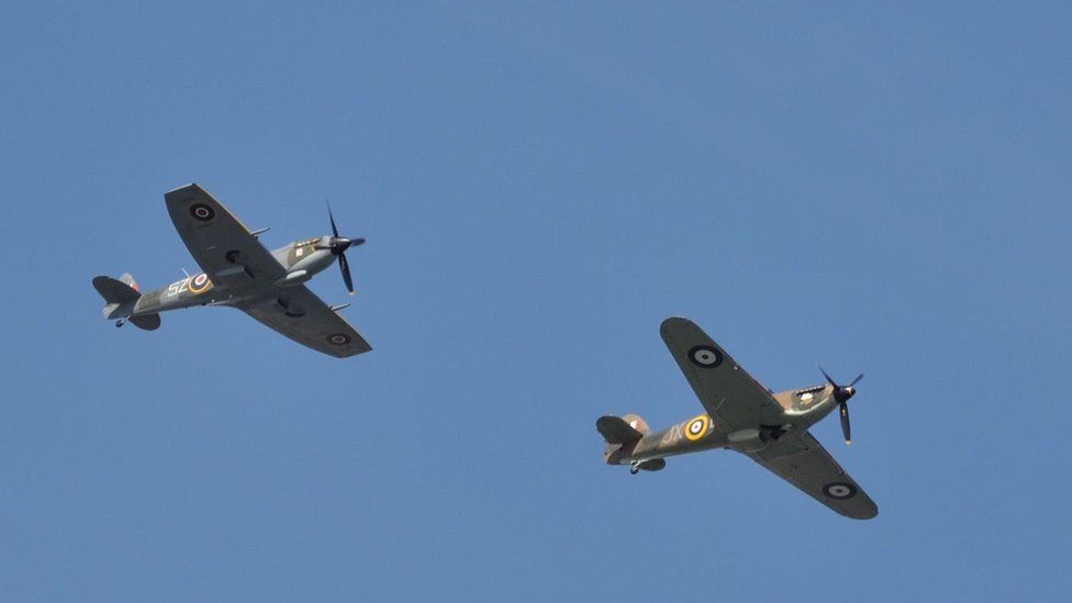 Spitfire and Hurricane aircraft fly next to each other