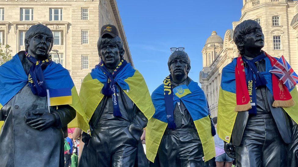 Eurovision Beatles statue with Ukraine flags