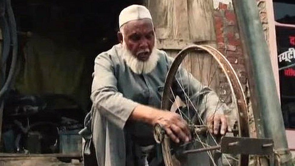 Mohammad Shareef repairing a cycle wheel