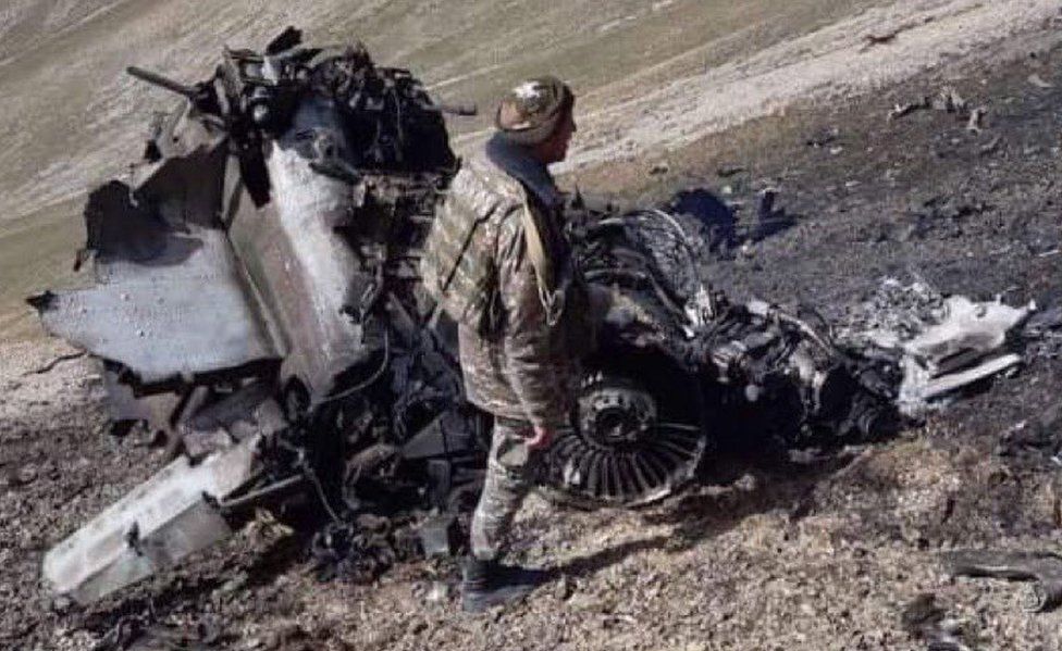 Armenia's defence ministry has published photos of an SU-25 jet it claims was shot down by a Turkish warplane
