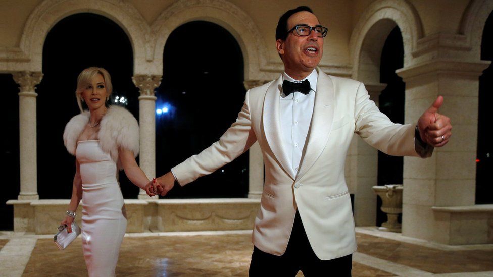 Steven Mnuchin and his wife Louise Linton arrive for a New Year's Eve party with U.S. President Donald Trump at his Mar-a-Lago club in Palm Beach, Florida, on 31 December 2017.