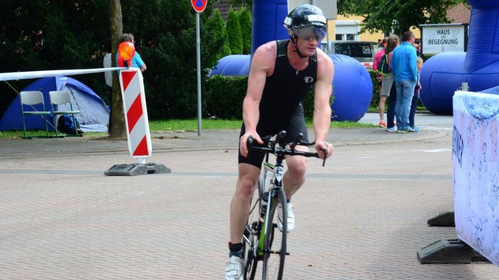 A man riding a road bike