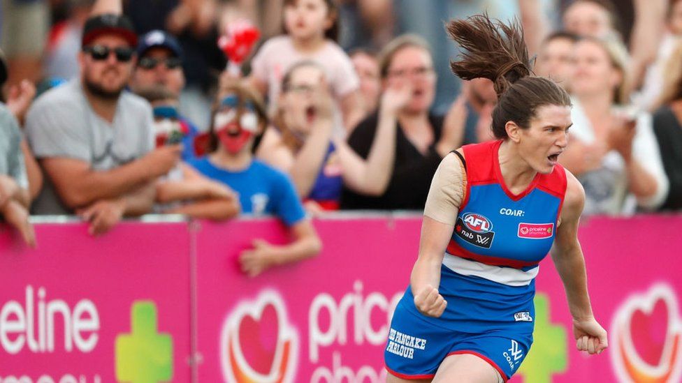 Kirsten McLeod, from the Western Bulldogs, celebrates after kicking a goal