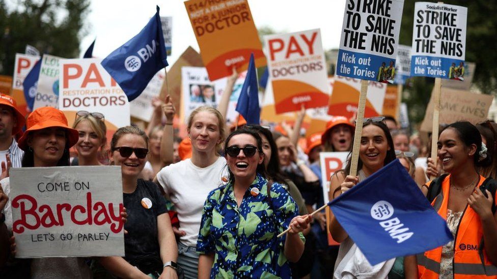 Demonstrators calling for better pay for junior doctors hold a protest outside the gates of Downing Street in central London in August 2023