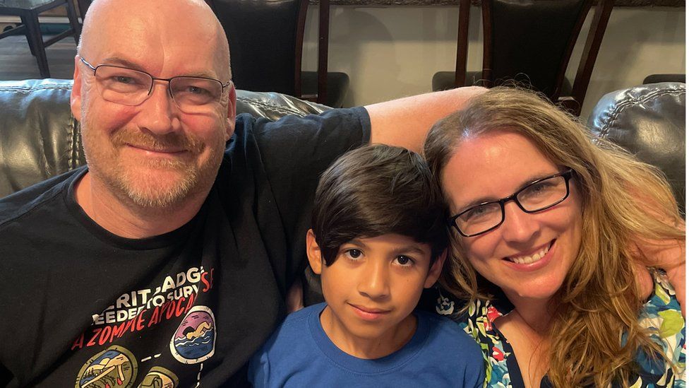 Porter Olsen, 11, with parents Michael and Nicole