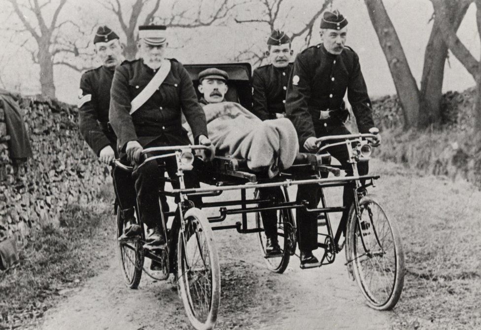 A man in a cycle ambulance from the 1910s