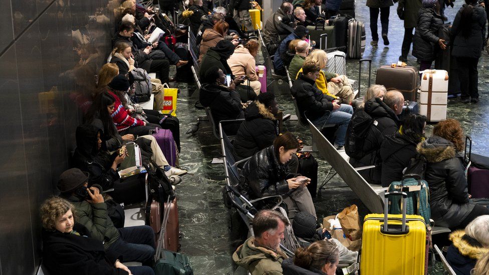 Passengers at Euston station, London,