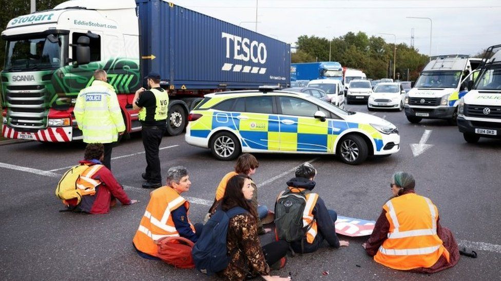 Insulate Britain activists on the M25 motorway in Thurrock, on 13 October 2021