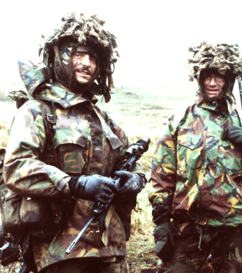 Two soldiers in full camouflage gear