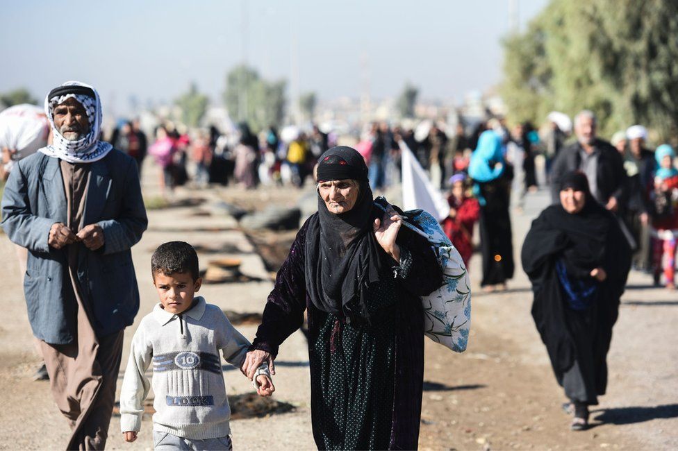 Civilians from eastern Mosul head to a camp for displaced people, 3 November
