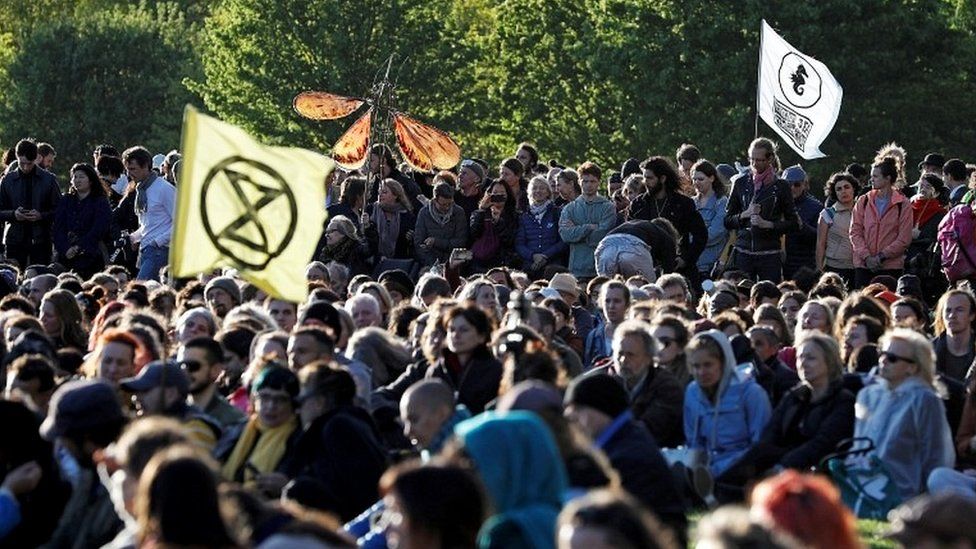 Climate change activists attend the closing ceremony