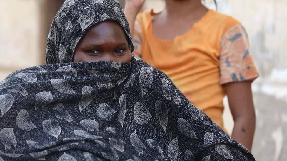 A woman in a camp for people displaced in the conflict, near Port Sudan, Sudan