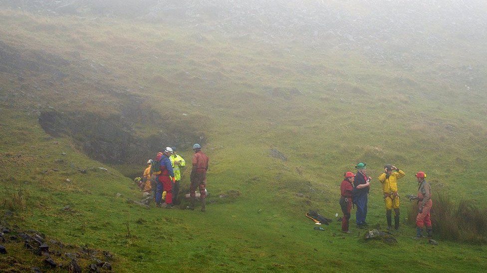 Rescuers at the entrance of the Ogof Ffynnon Ddu caves, 8 November 2021