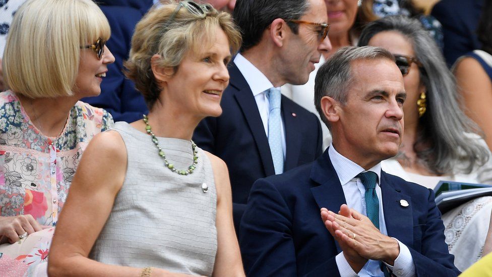 Mark Carney and his wife Diana Fox attend a match at Wimbledon in July