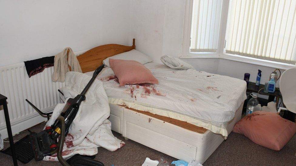 A bedroom with blood stains at the Wharton Terrace Home