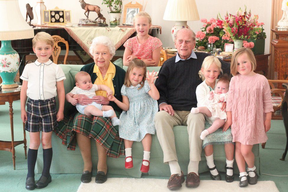 Pictured (left to right) Prince George, Prince Louis being held by Queen Elizabeth II, Savannah Phillips (standing at rear), Princess Charlotte, the Duke of Edinburgh, Isla Phillips holding Lena Tindall, and Mia Tindall.