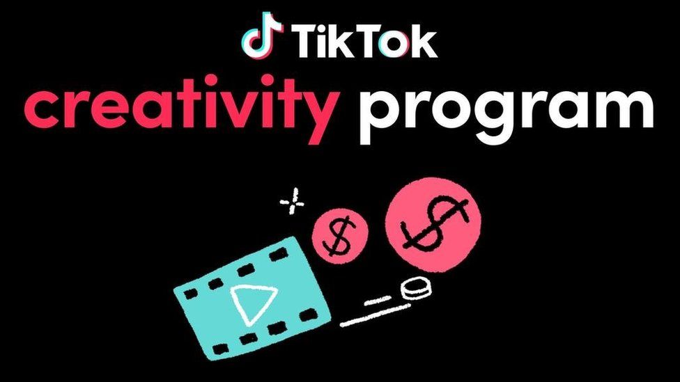 A black background with the TikTok logo - A musical note style glyph next to the app's name in white at the top. Below that the words "creativity program" appear - the first word is in a pinkish red, the second in white. Below that a light blue rectangle with a white play button triangle on it appears next to two pink circles with dollar signs on them - presumably meant to represent coins.