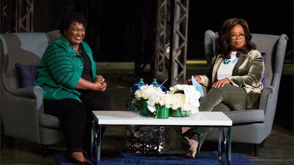 Oprah Winfrey and Stacey Abrams on stage