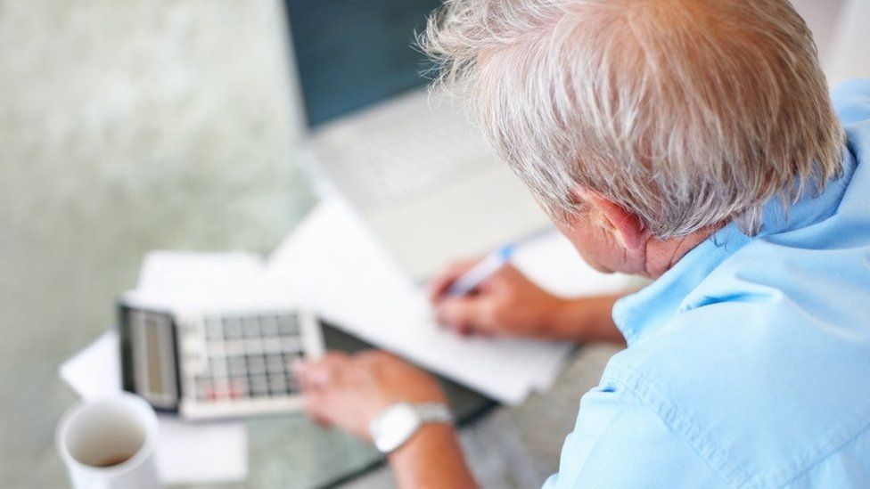 Pensioner with calculator