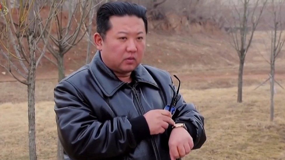 Kim Jong-un points to the watch in the video to give the signal for the launch