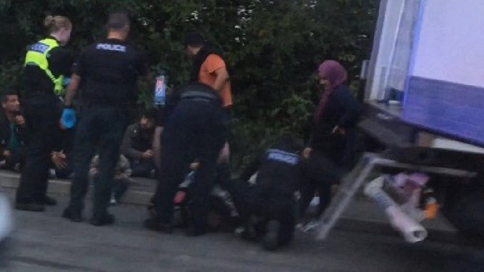 Suspected illegal immigrants removed from a lorry near Bicester Village