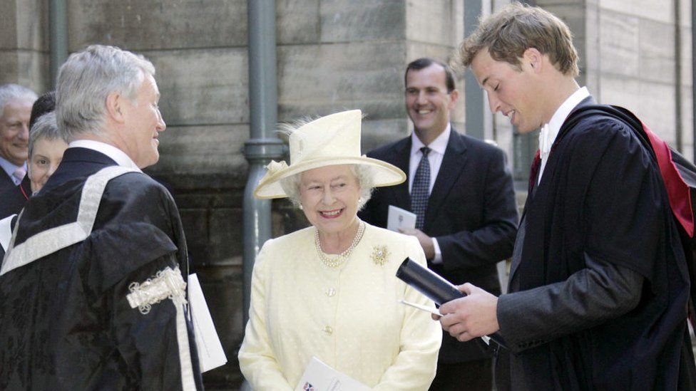 Britain's Queen Elizabeth II (C) stands next to Prince William (R) after his graduation ceremony at St Andrews, Scotland, 23 June 2005. Prince William, the second in line to the British throne, graduated from university 23 June to embark on a new chapter in his life, which will include work experience in London and a possible army career. The 23-year-old said he was entering the "big wide world" after gaining a masters degree in geography from St. Andrews University, Scotland, where he has spent the past four years tucked away from the prying eyes of the media. AFP PHOTO/Michael Dunlea/POOL (Photo by MICHAEL DUNLEA / POOL / AFP) (Photo by MICHAEL DUNLEA/POOL/AFP via Getty Images)