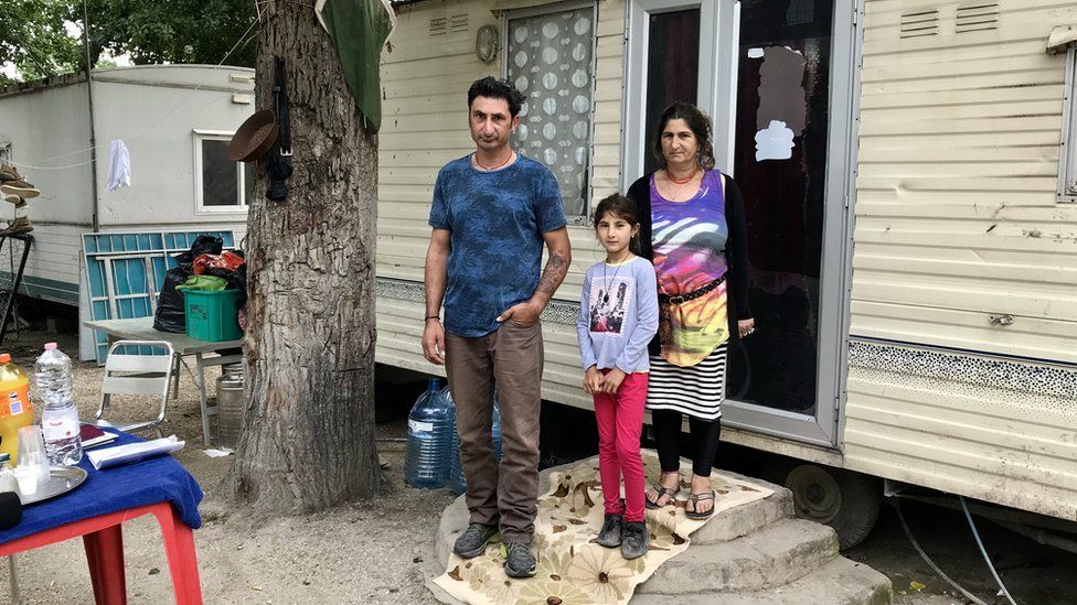 Roma families live in trailers in River camp