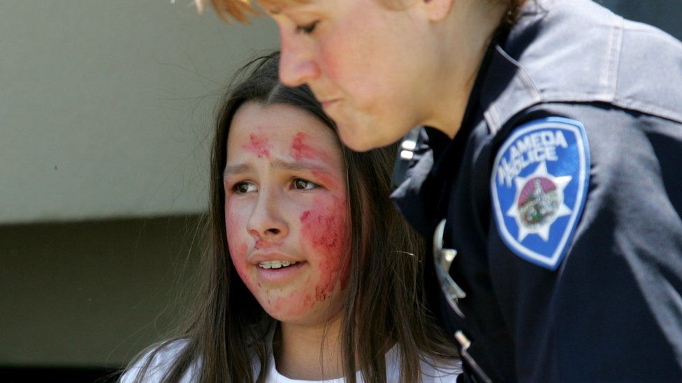 A student with fake blood on their face during an active shooter drill in California