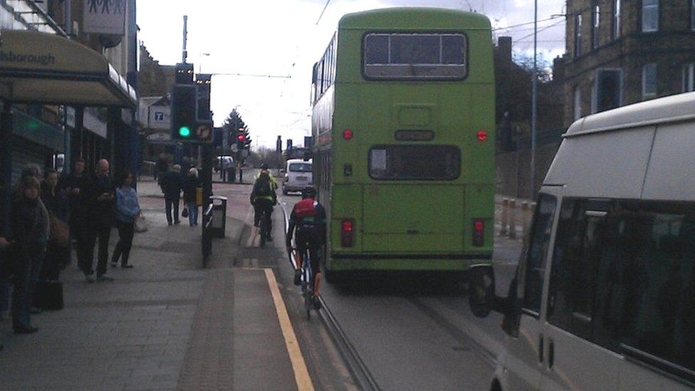 Cyclist near tram tracks in Sheffield