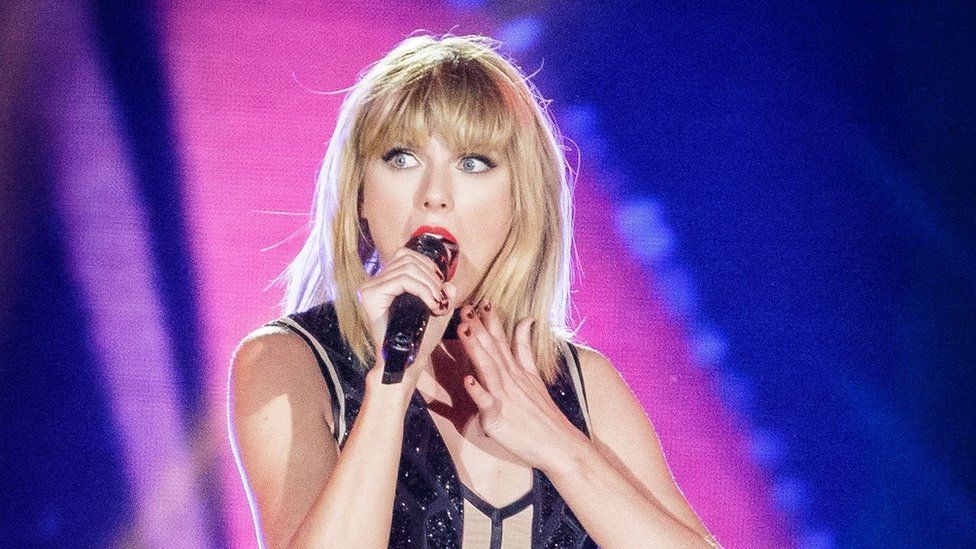 Taylor Swift singing on stage in Austin, Texas, in 2016
