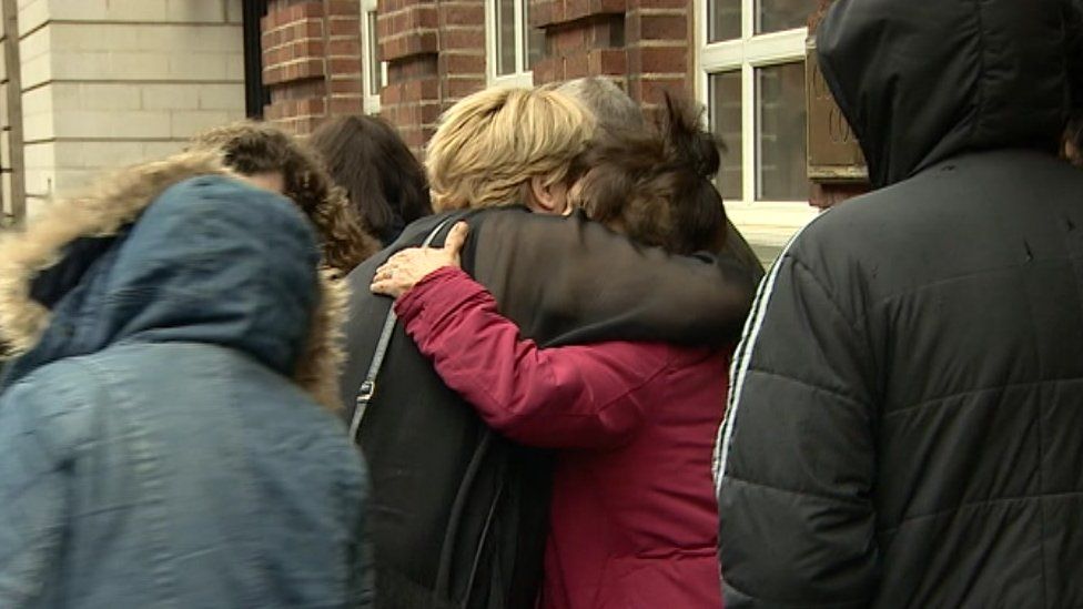 Family members outside of court on Friday