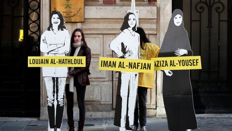 Demonstrators from Amnesty International stage the protest on International Women"s day