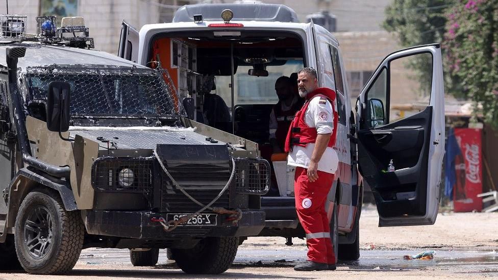 The Israeli army search an ambulance outside a hospital during a military operation in the West Bank city of Jenin, 29 August 2024