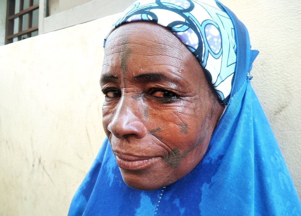 A woman in blue hijab