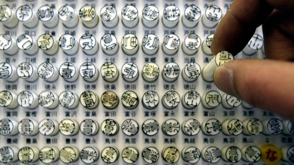 A consumer picks one of 'Hanko,' or personal seal in central Tokyo, 13 March 2004.