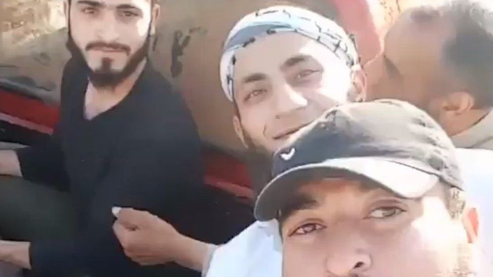 Screengrab of video purportedly showing members of Syrian rebel Nour al-Din al-Zinki Movement before they behead a boy in Aleppo (19 July 2016)
