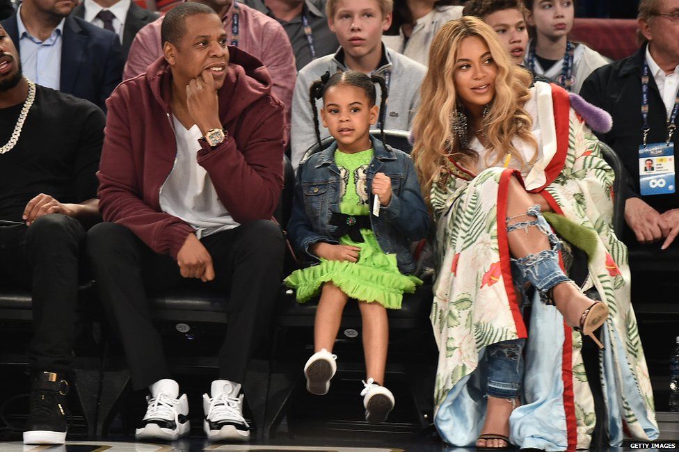 The rapper and his wife Beyonce with their daughter Blue Ivy at a basketball game