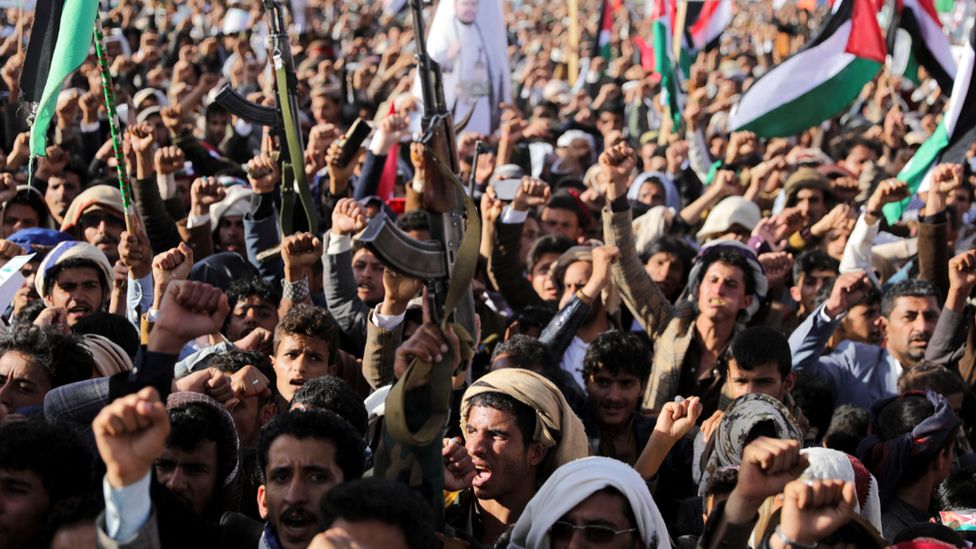 Supporters of the Houthi movement protest against air strikes launched by the UK and US on Houthi targets