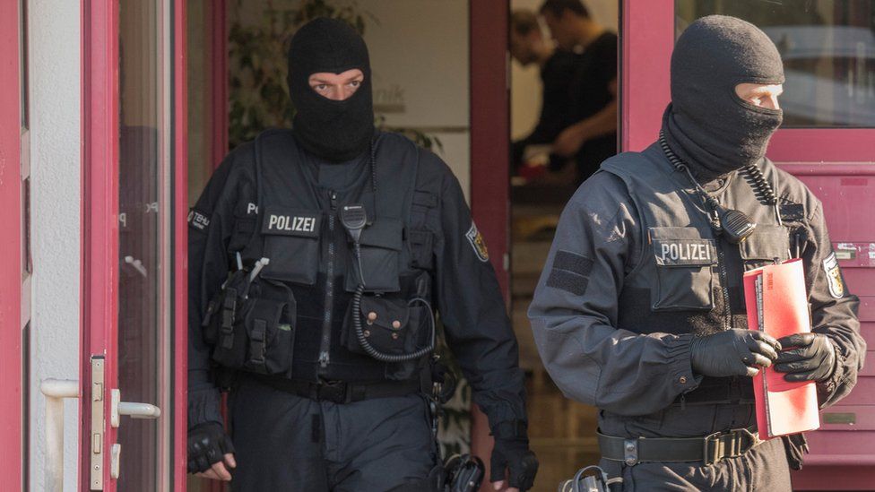 Federal police officers raid a brothel in Maintal, western Germany in April 2018