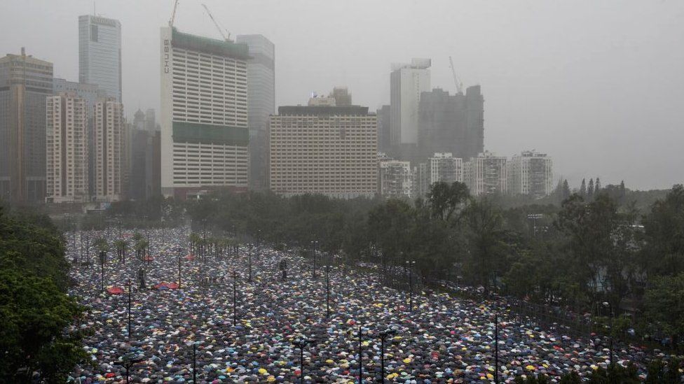 Thousands of demonstrators gather at Victoria Park area during a protest organized by the Civil Human Rights Front
